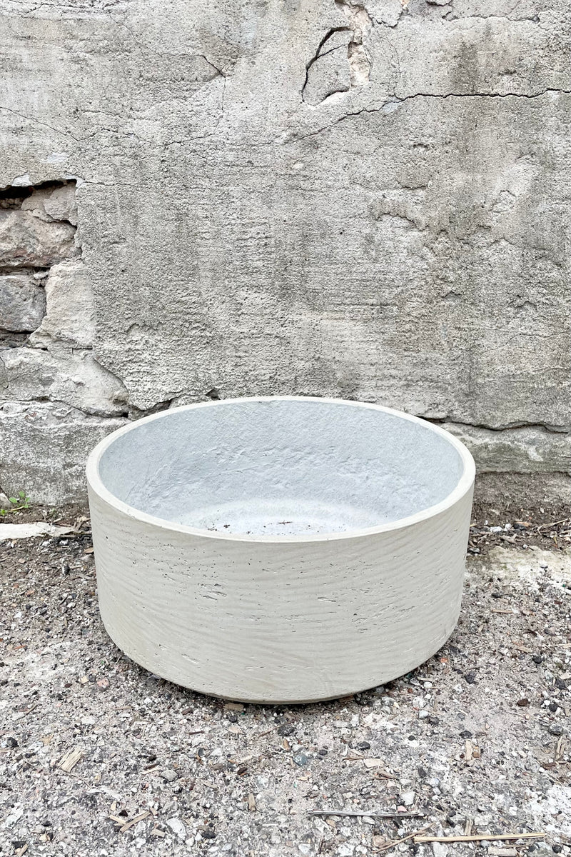 Detail of top of Eli Bowl grey washed medium against a grey wall