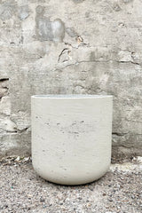 Charlie Pot grey washed extra large against a grey wall