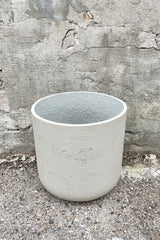 Detail of top of Charlie Pot grey washed extra large against a grey wall