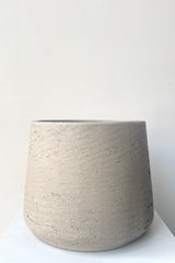 A frontal view of Patt Pot Grey Washed Large against a white backdrop