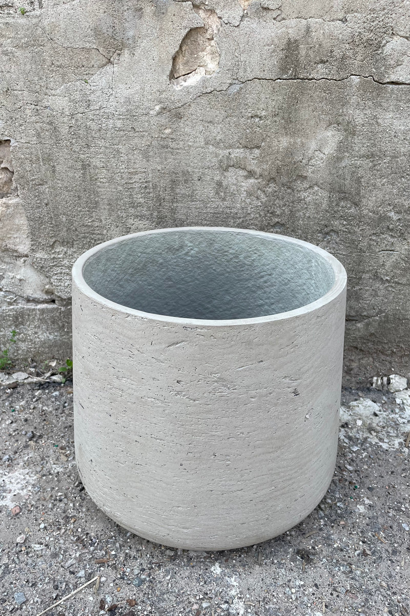 detail of the top of Patt Pot Grey Washed Extra Extra Large against a grey wall