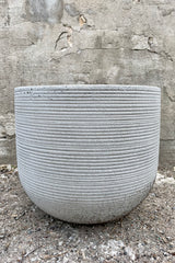 Cody Pot horizontal ridged light grey medium against a grey wall