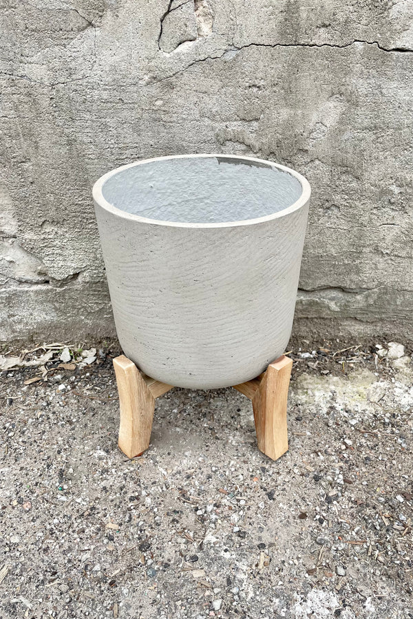 Detail of the top of the Charlie Pot & low stand grey washed large against a grey wall