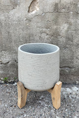 detail of the top of Patt Pot w/ Low Feet Grey Washed Extra Large against a grey wall