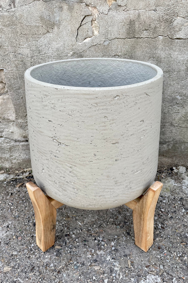 detail of Patt Pot w/ Low Feet Grey Washed Extra Extra Large against a grey wall