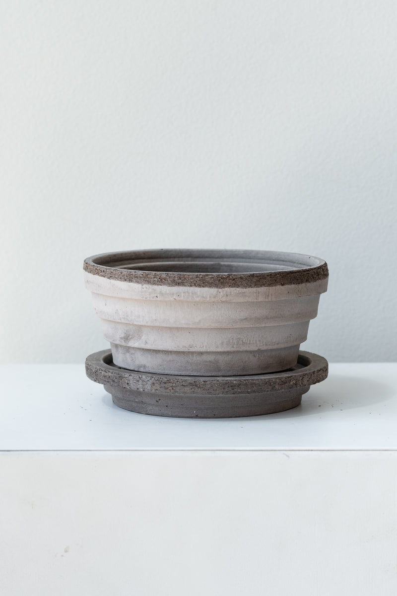 Grey 4.7 inch Planets Pot by Bergs Potter on a white surface in a white room