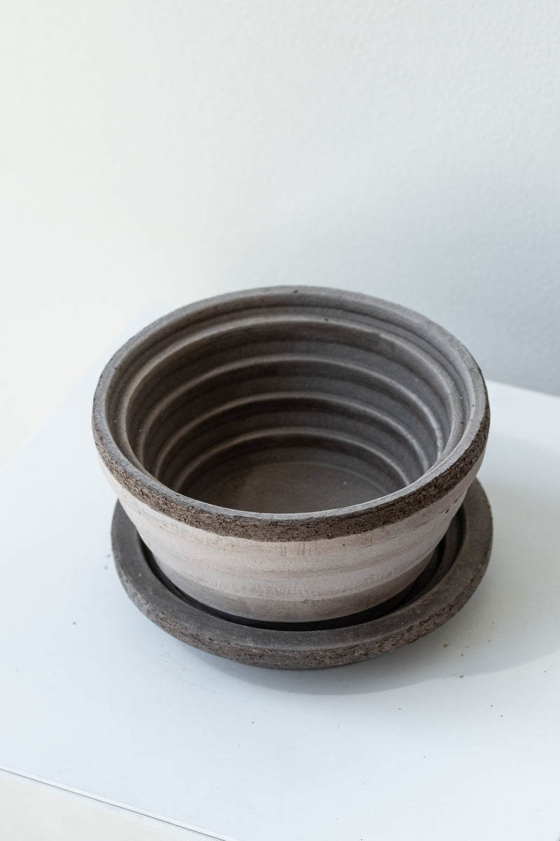 Grey 4.7 inch Planets Pot by Bergs Potter on a white surface in a white room