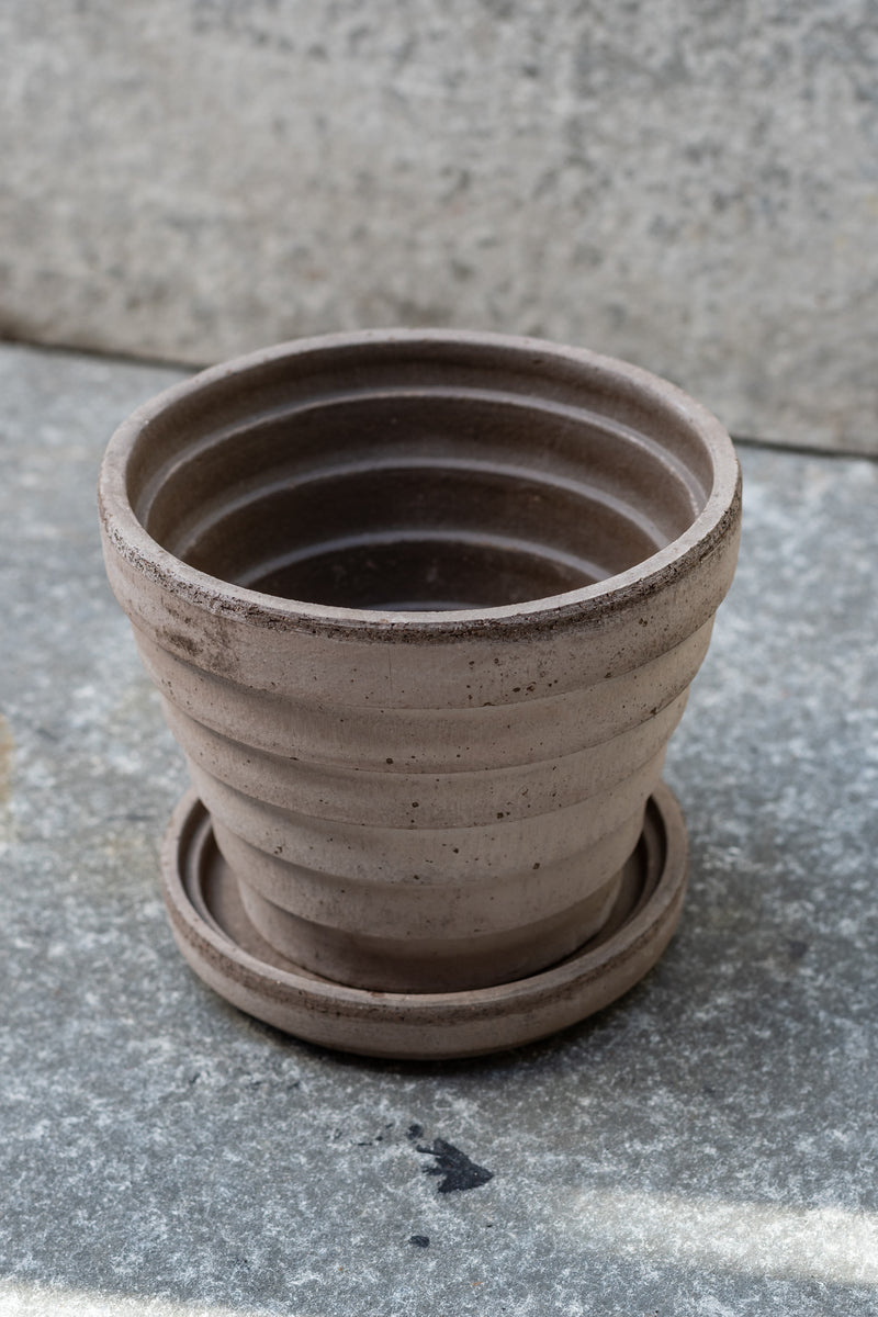 Grey 5.5 inch Planets Pot by Bergs Potter on a grey surface with a grey background