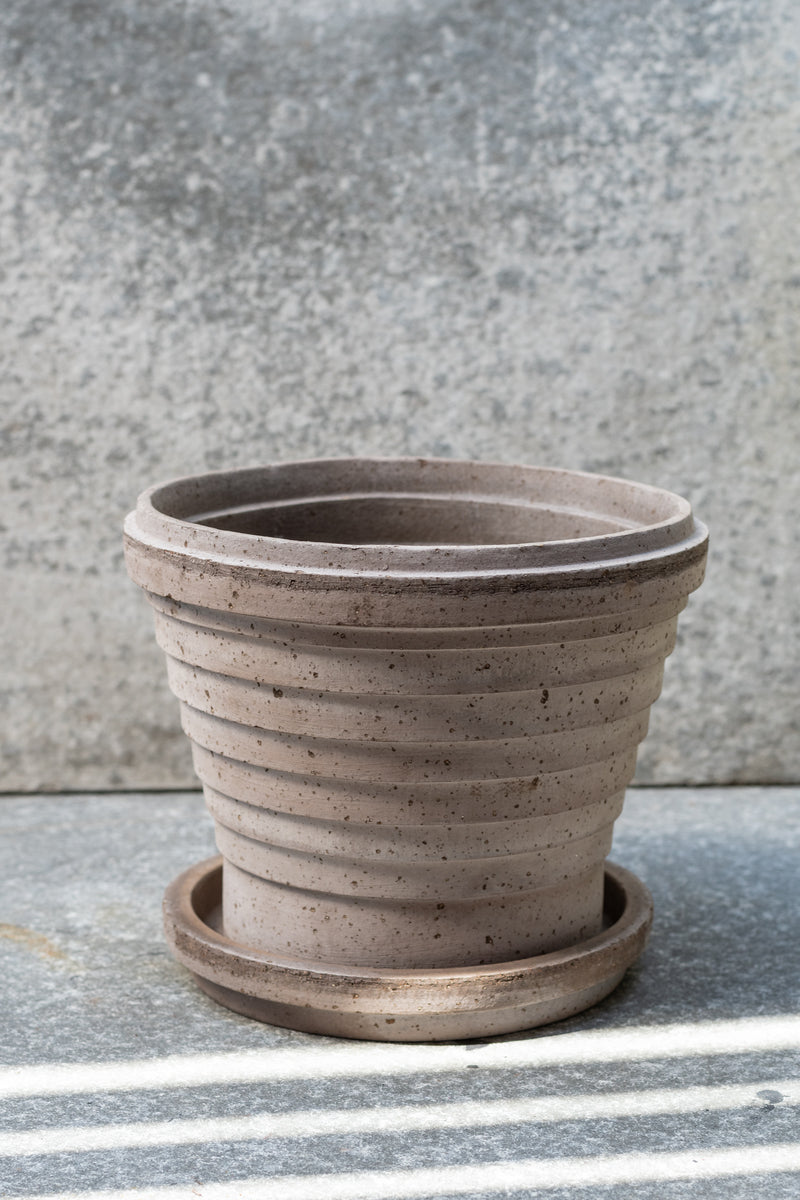 Grey 8.3 inch Planets Pot by Bergs Potter on a grey surface with a grey background