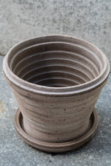 Grey 8.3 inch Planets Pot by Bergs Potter on a grey surface with a grey background