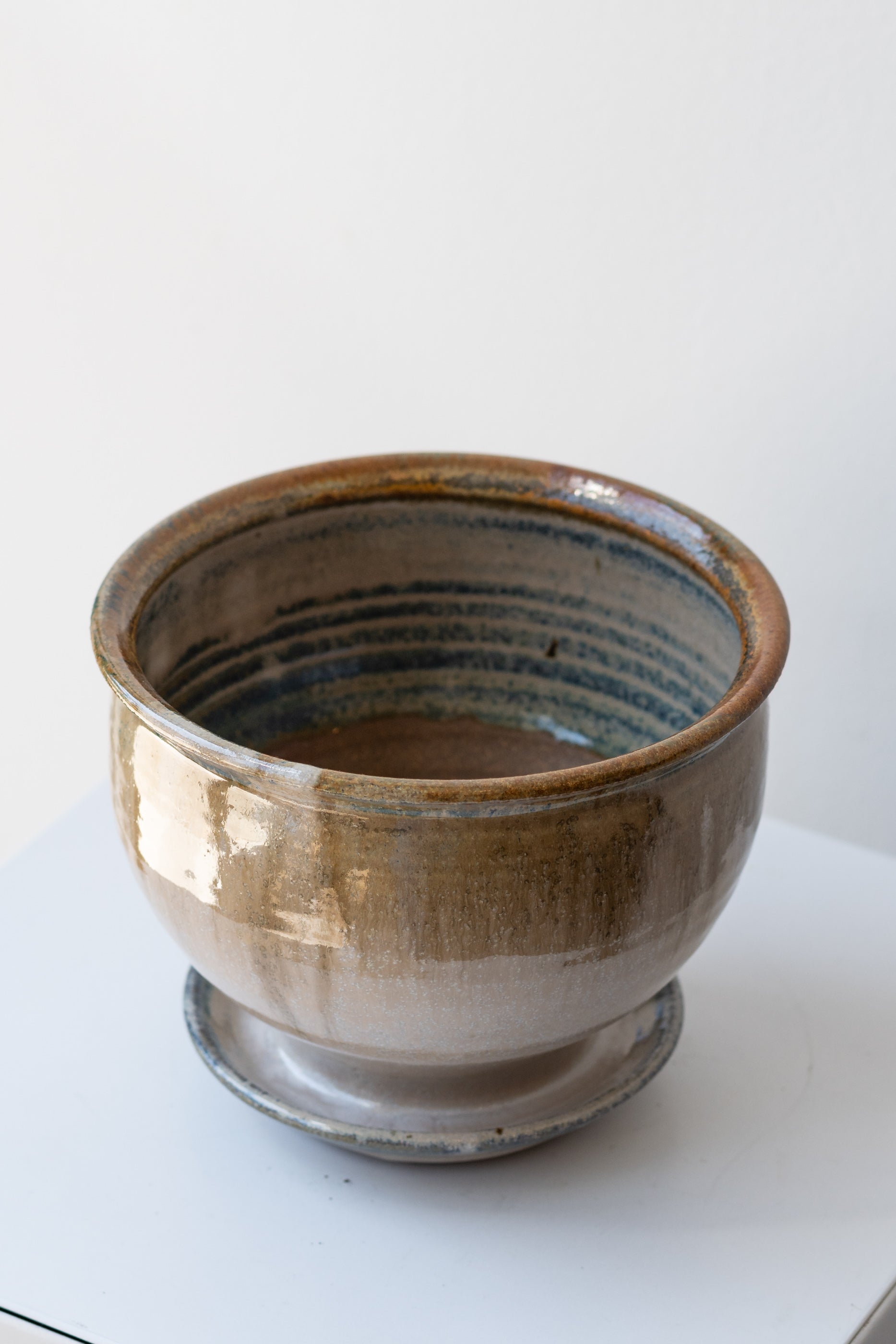 Bruning Pottery Planter ivory & iron glaze - 4" on white surface in a white room