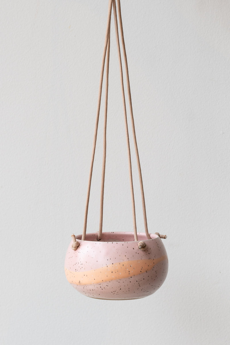 Miami Pink Orb Hanging Planter, rose quartz & apricot glaze in front of white background