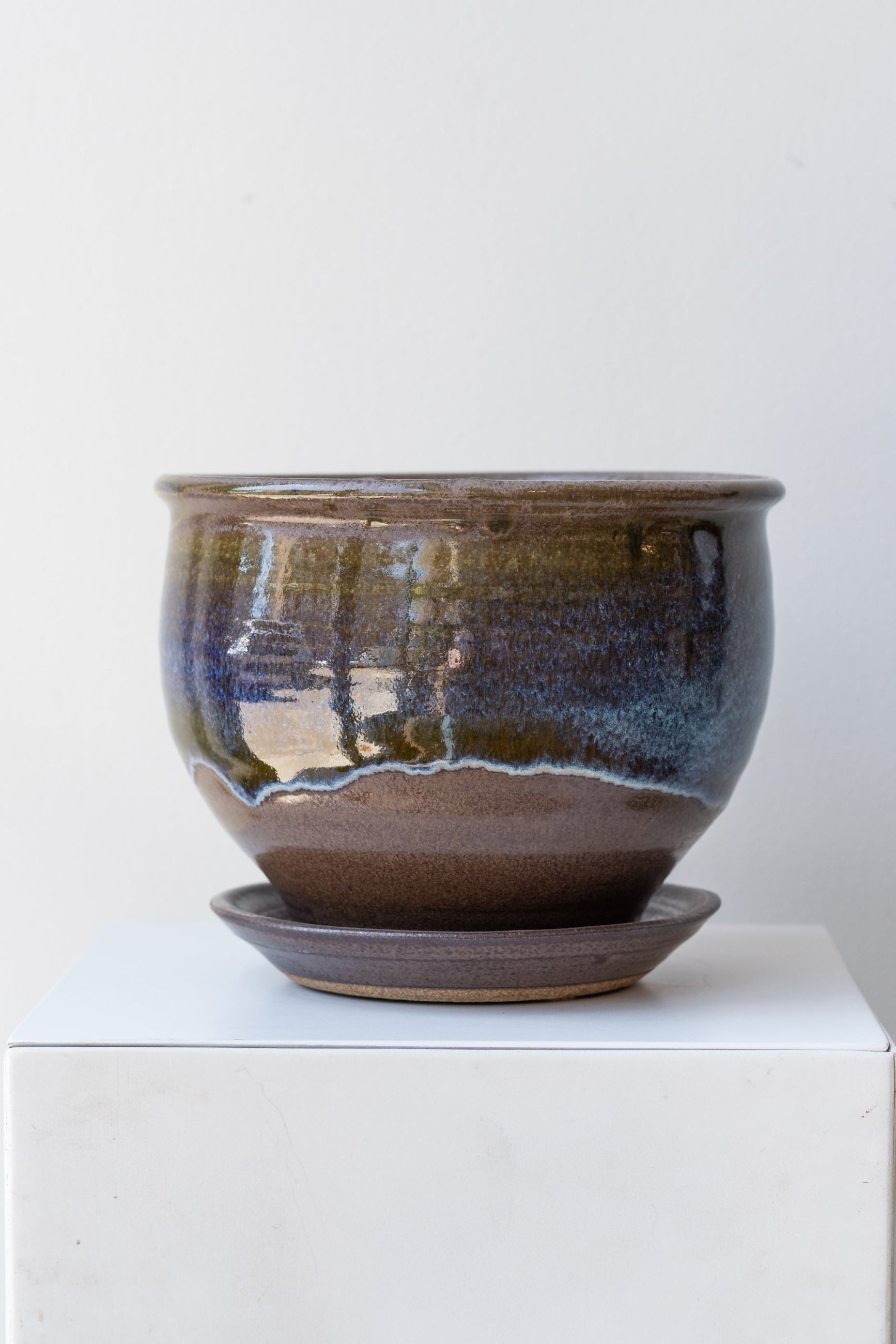 Bruning Pottery Planter moss & lilac glaze - 6" on a white surface in a white room ©Sprout Home