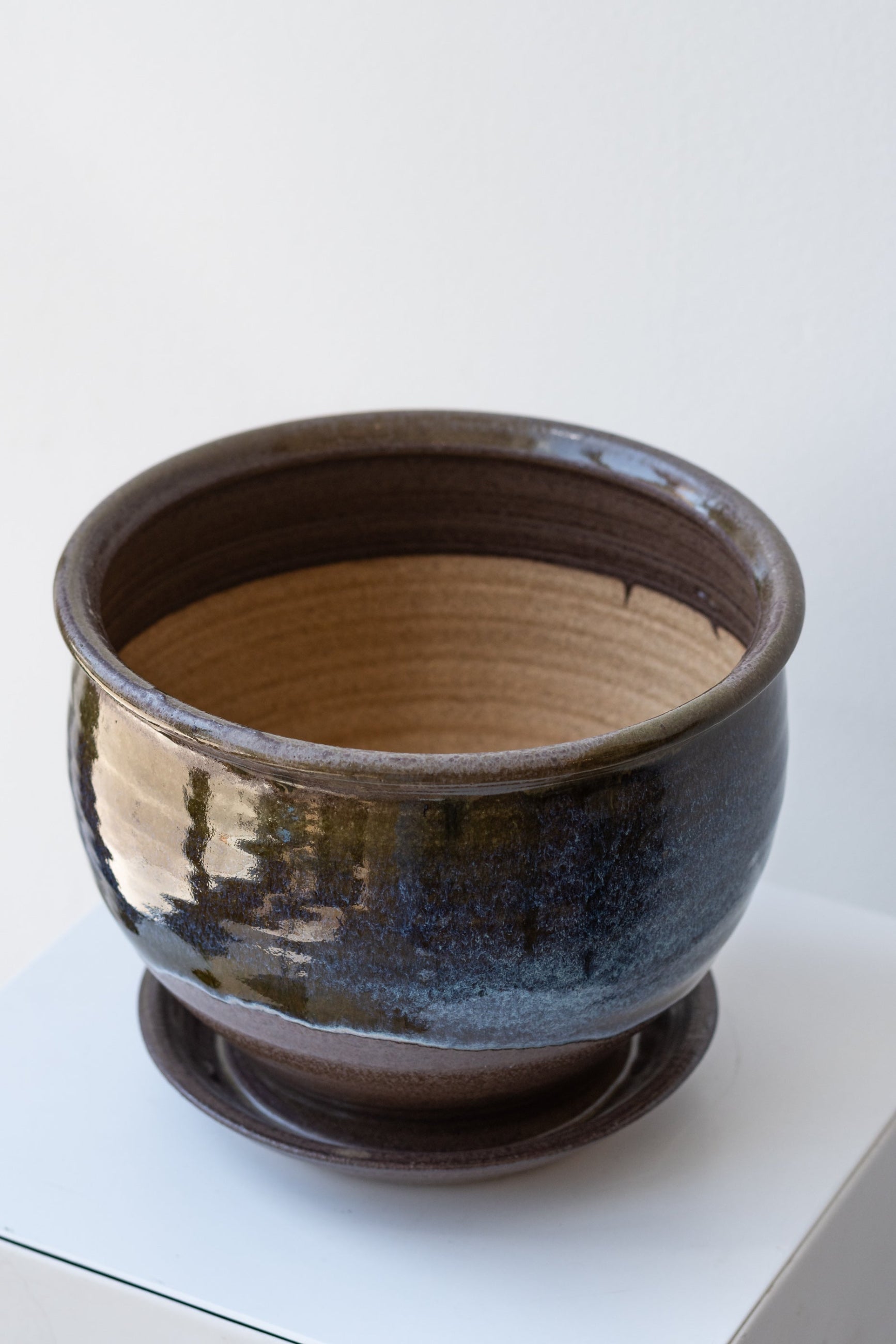 Bruning Pottery Planter moss & lilac glaze - 6" on a white surface in a white room ©Sprout Home