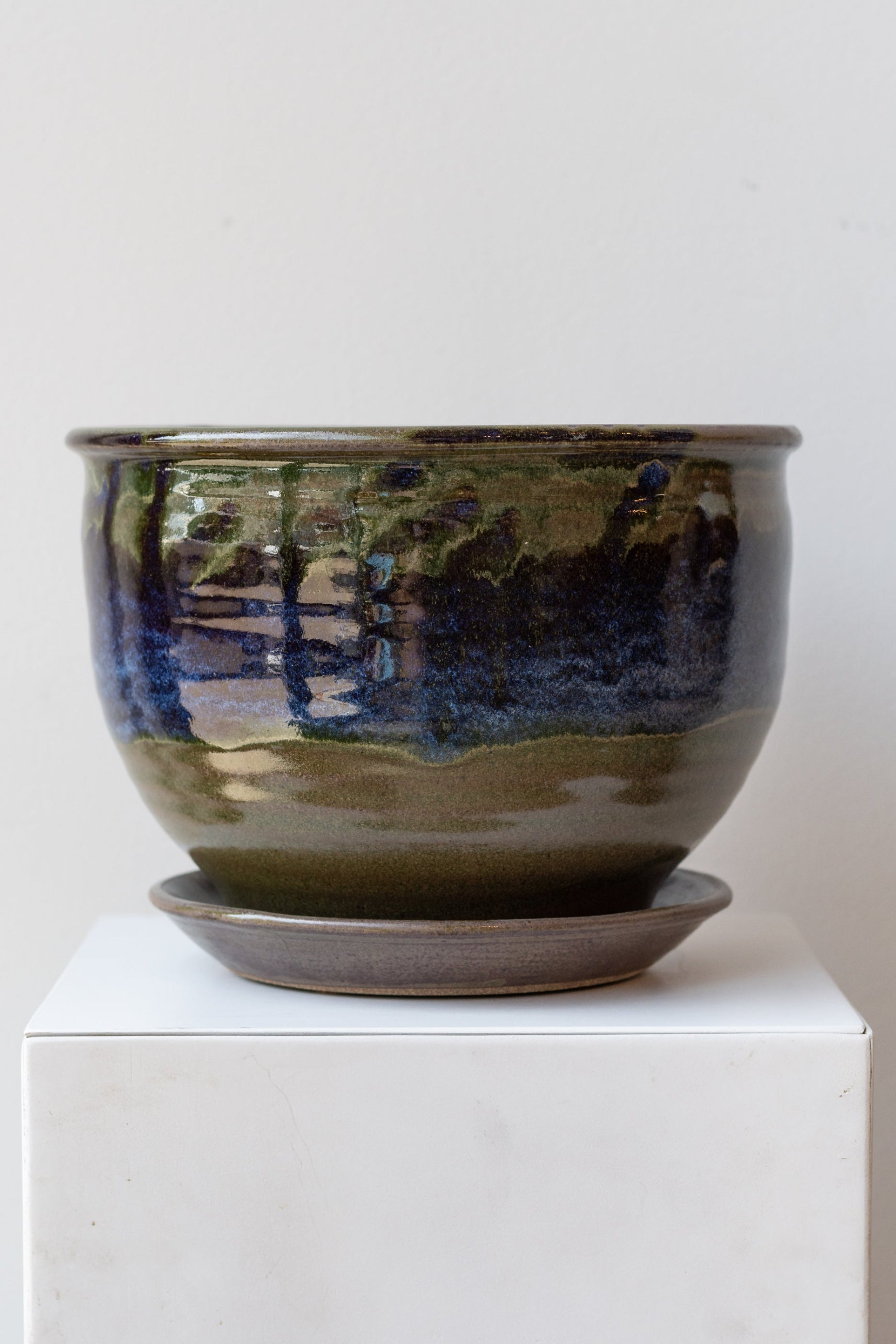 Bruning Pottery Planter moss & lilac glaze - 8" on a white surface in a white room ©Sprout Home