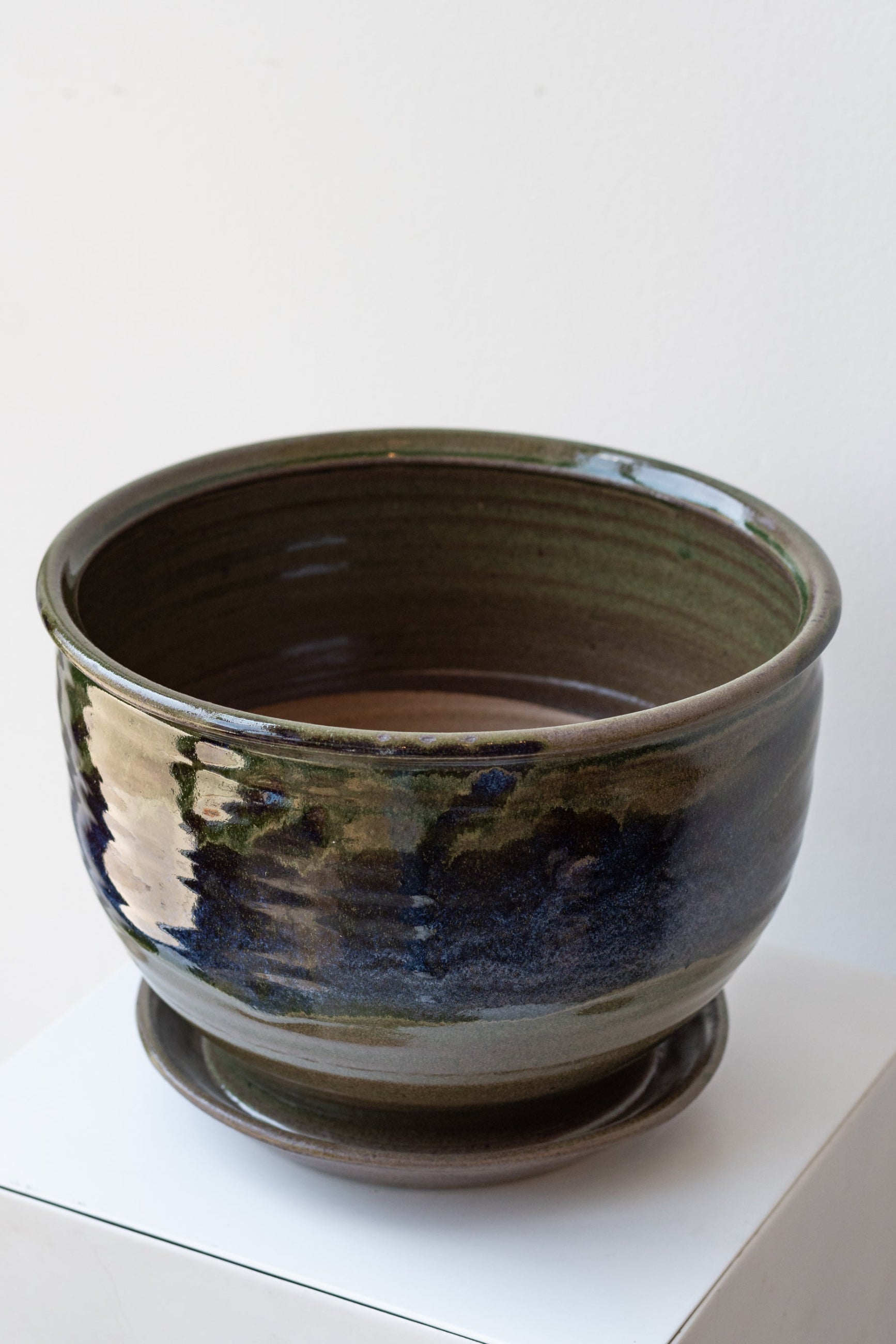 Bruning Pottery Planter moss & lilac glaze - 8" on a white surface in a white room ©Sprout Home