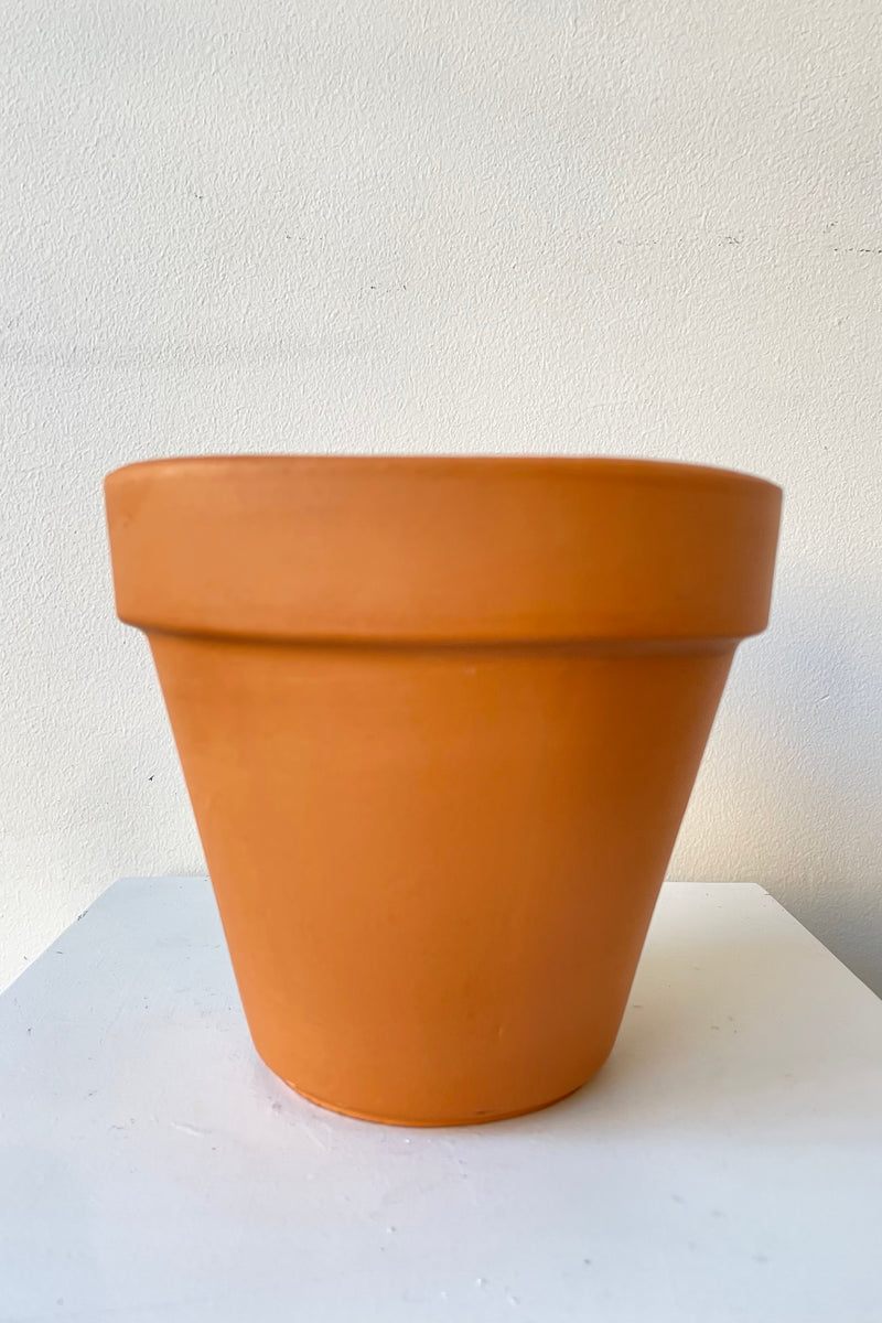 Clay Standard Pot Terracotta 5.9" against a white wall