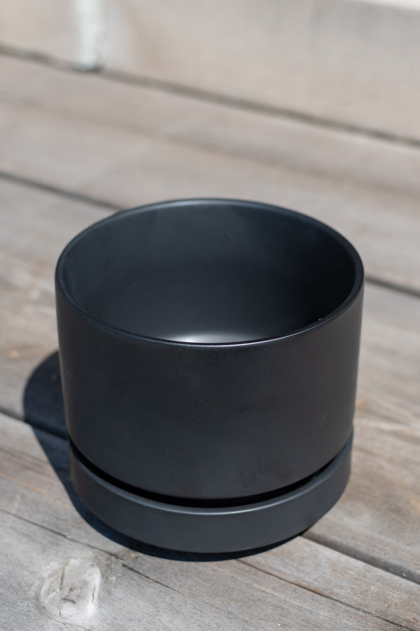 Round Pot & Saucer black 4" by LBE Designs in front of grey wood background