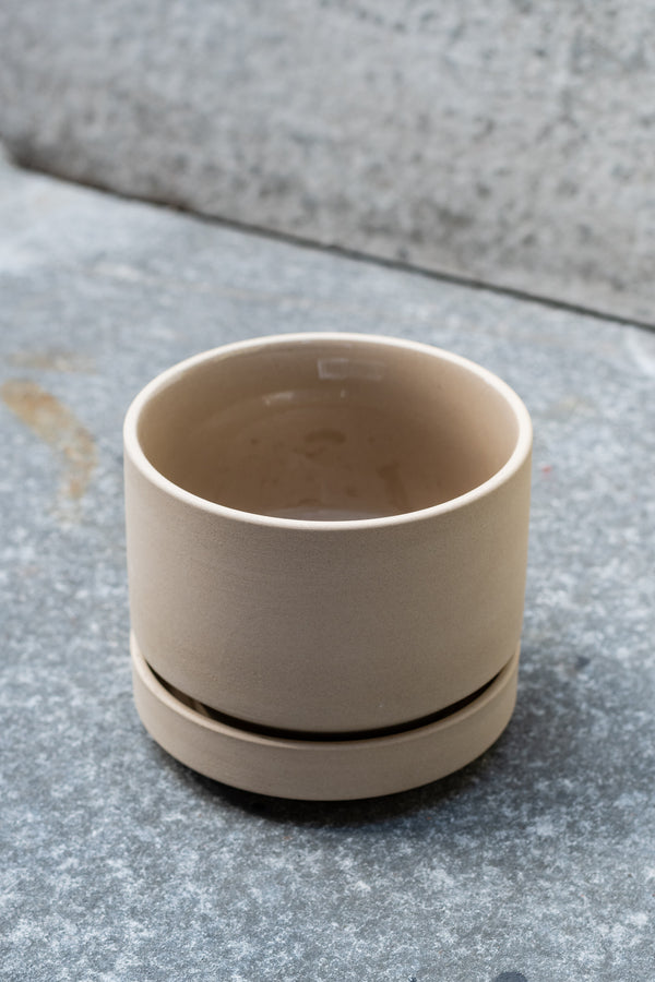 Beige stoneware planter with matching saucer by LBE Designs