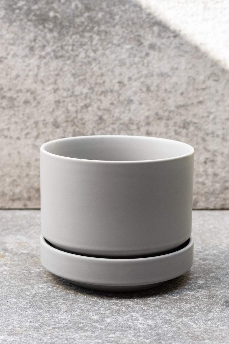 Grey stoneware planter with matching saucer by LBE Designs