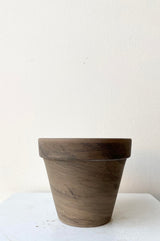 The Clay Pot dark basalt 4" sits against a white backdrop.