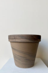 The Clay Pot dark basalt 8" sits against a white backdrop.