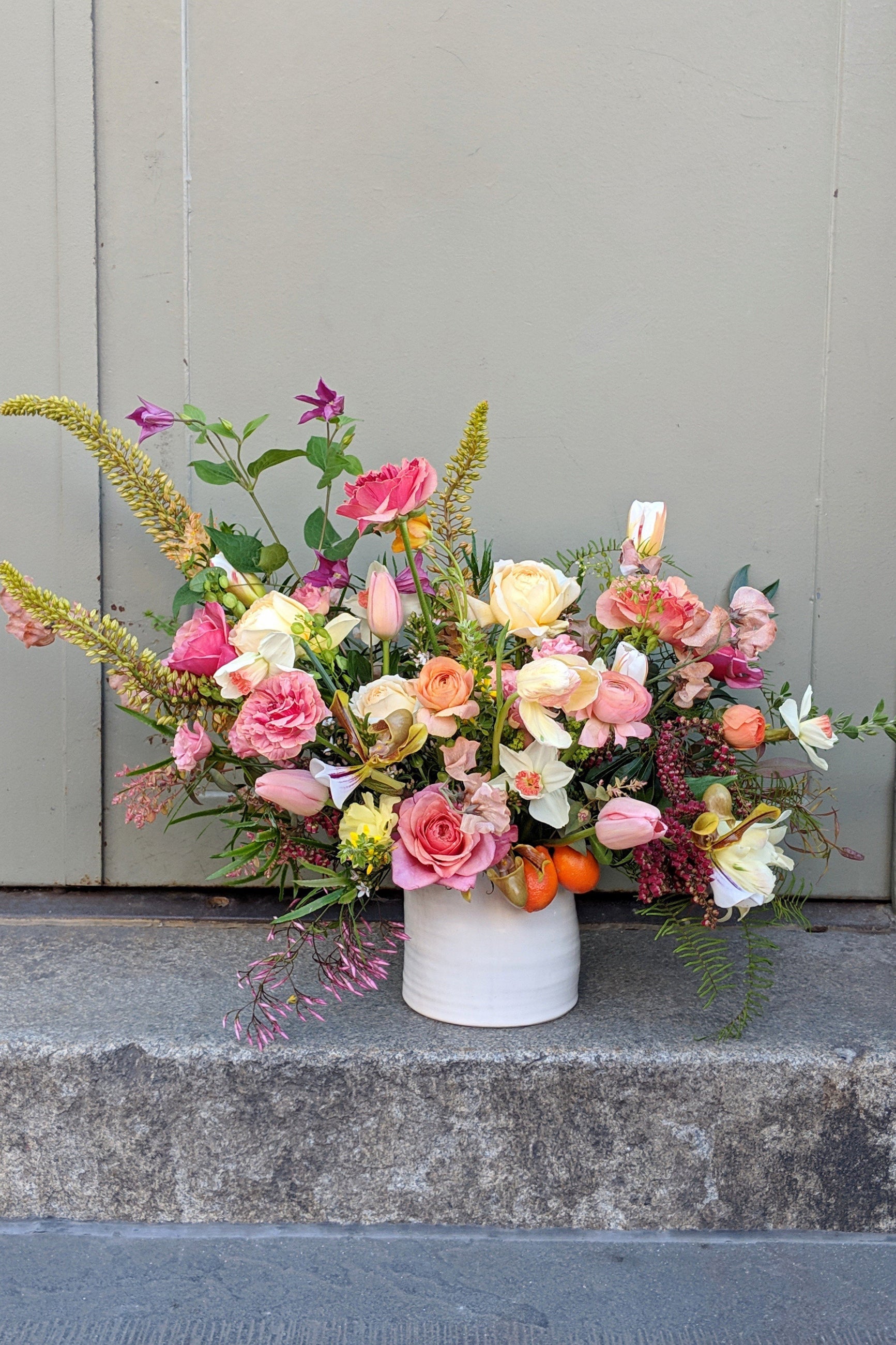 A flowing arrangement of cream and pink with roses and spring blooms created by Sprout Home ©Sprout Home #size_$200