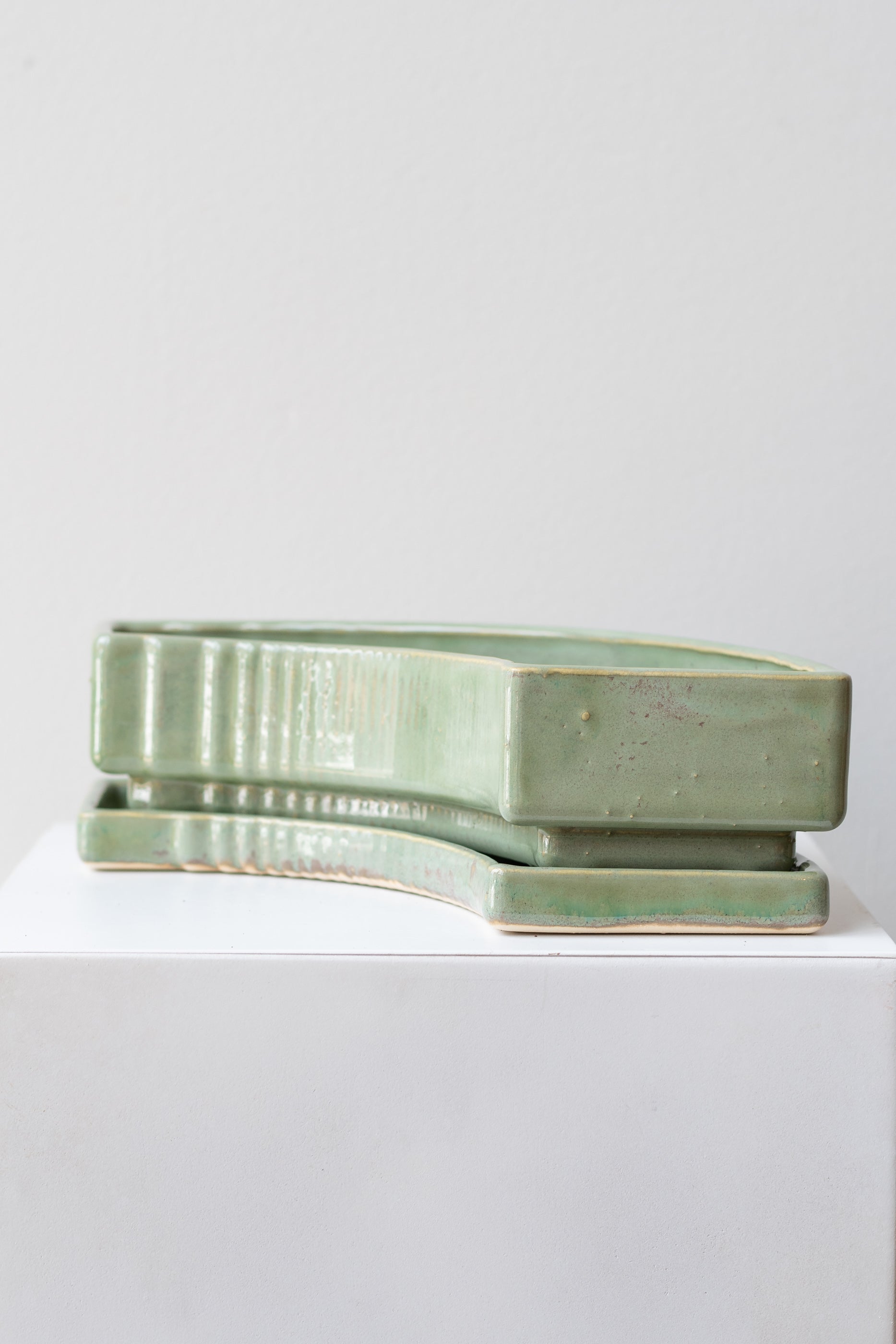People via plants Stella Planter sage on a white surface in a white room