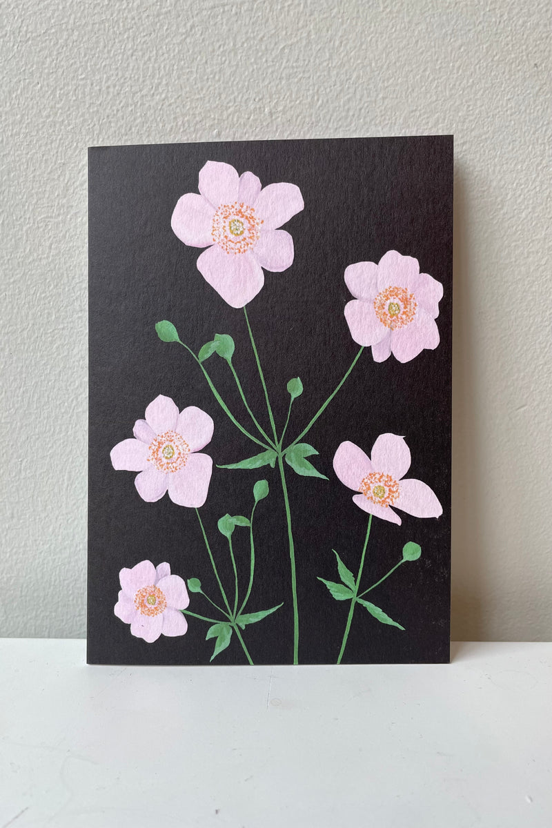 Thimbleweed card designed by Stengun Drawings against a white wall. 