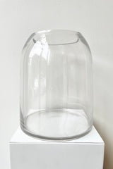 Glass Dome Terrarium Tall with an opening on top against a white wall