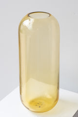 Hawkins New York large amber Aurora pill vase in front of white background