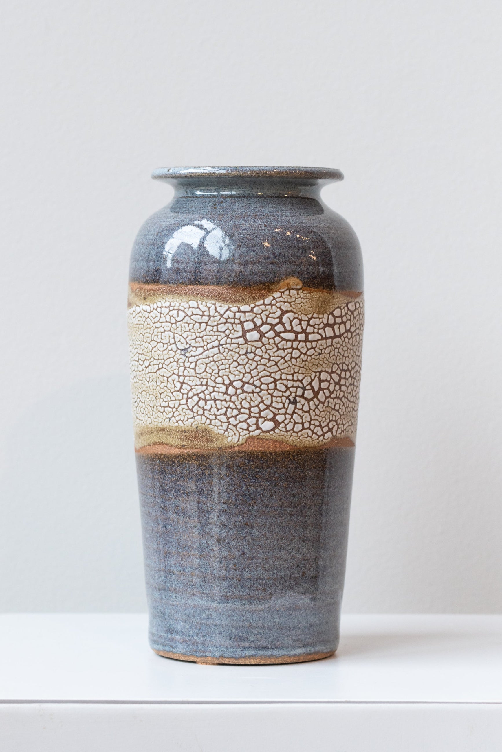 Bruning Pottery "super crackle" glazed tall ceramic vase in front of white background ©Sprout Home