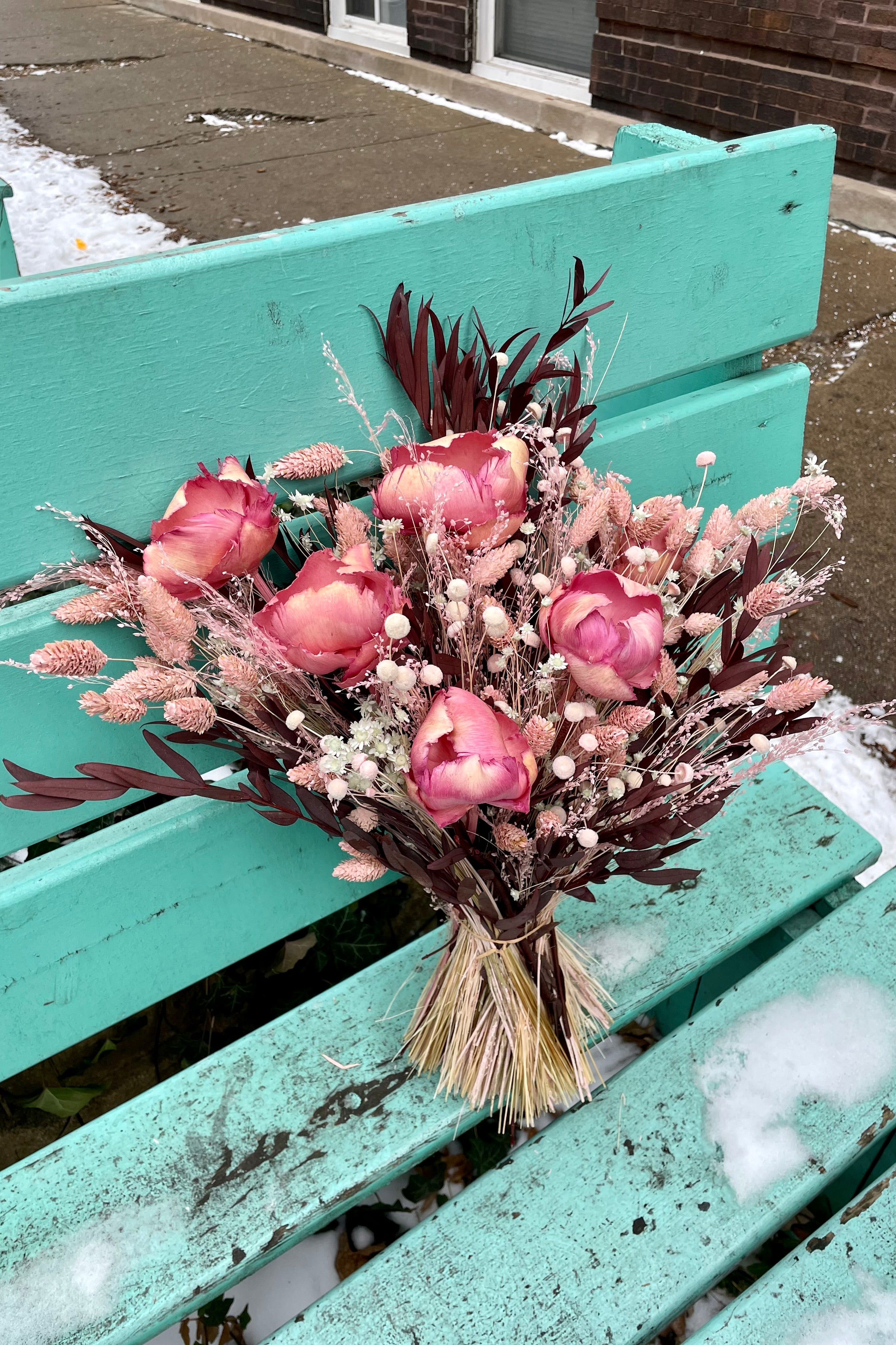 Sprout Home's Chocoberry Milkshake arrangement sitting on a blue bench. #size_$200