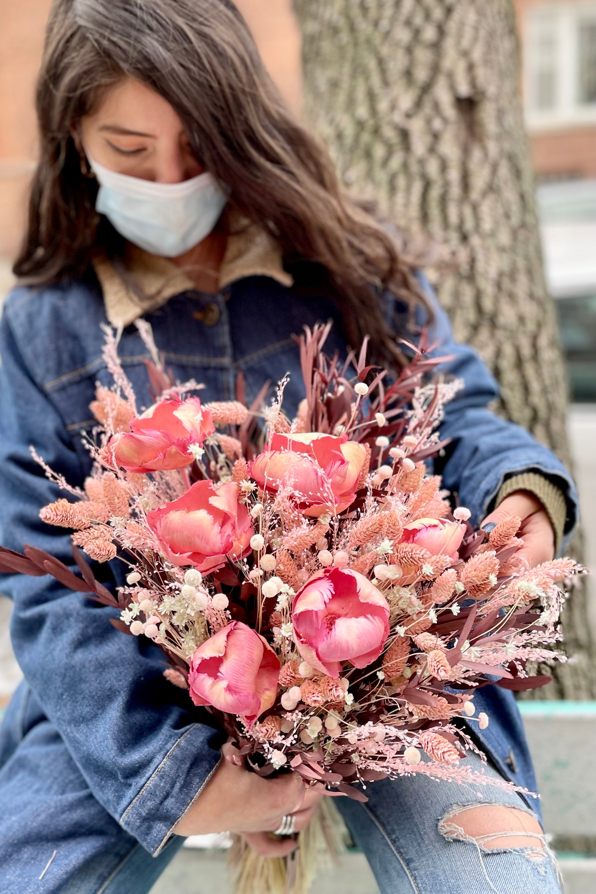 Sprout Home's Chocoberry Milkshake arrangement being held by one off our floral designers. #size_$200