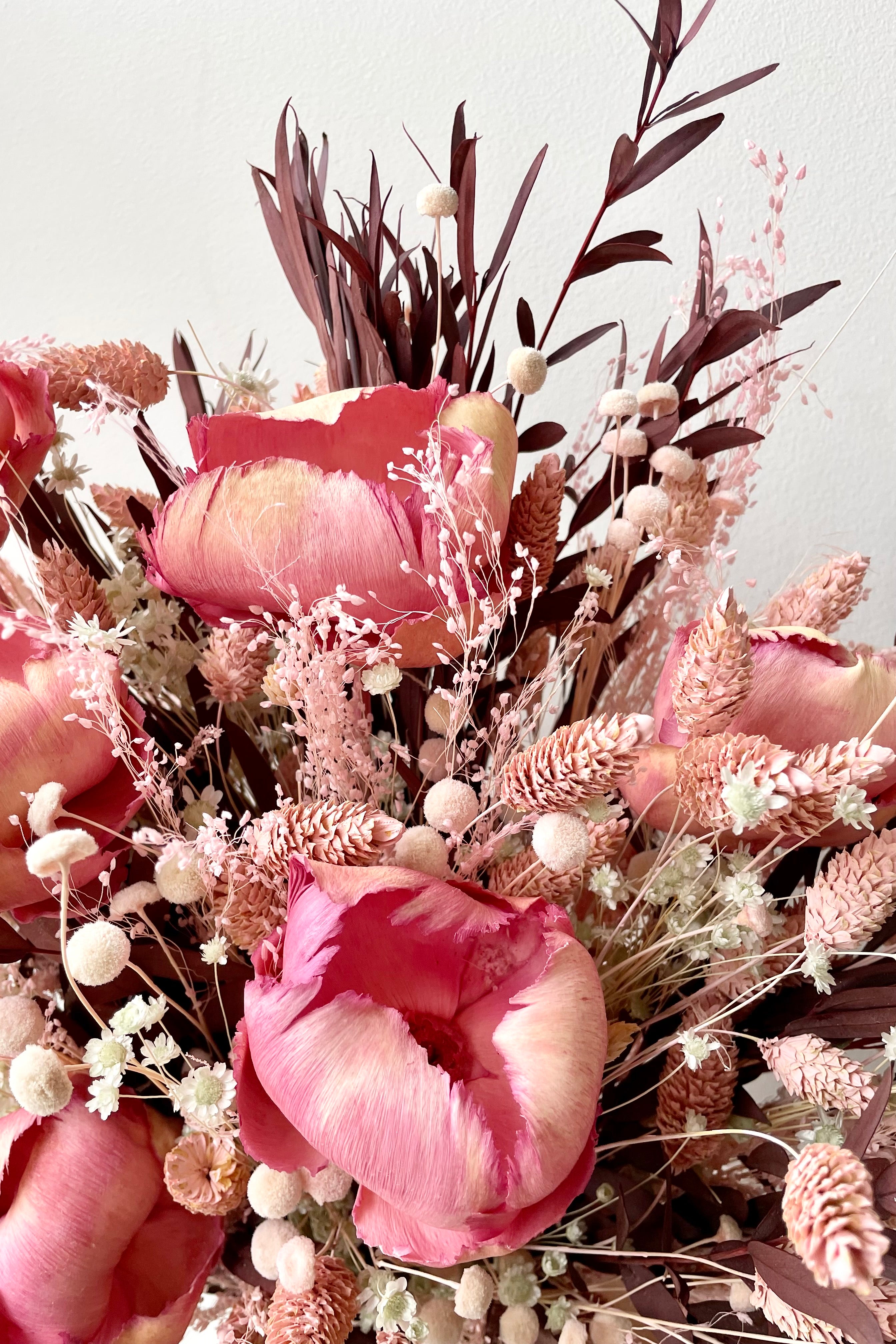 Sprout Home's Chocoberry Milkshake arrangement detail picture showing the pink flowers and chocolate foliage. #size_$200