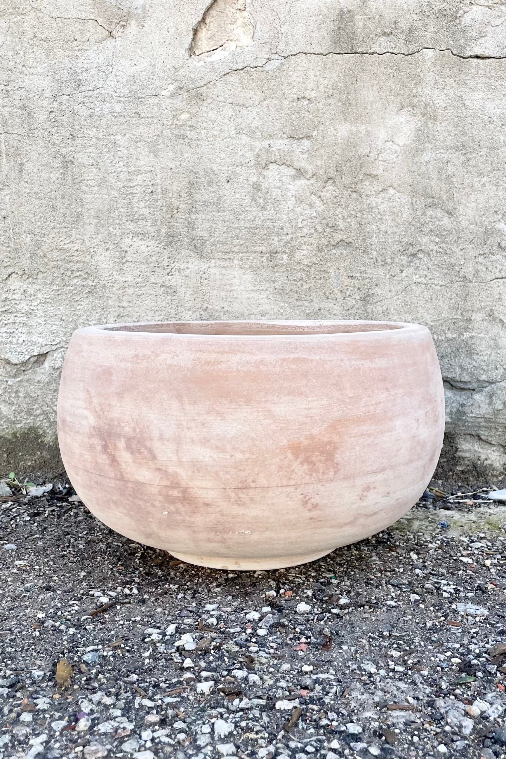 Yumiko Unglazed Bowl Small against a grey wall  ©Sprout Home 
