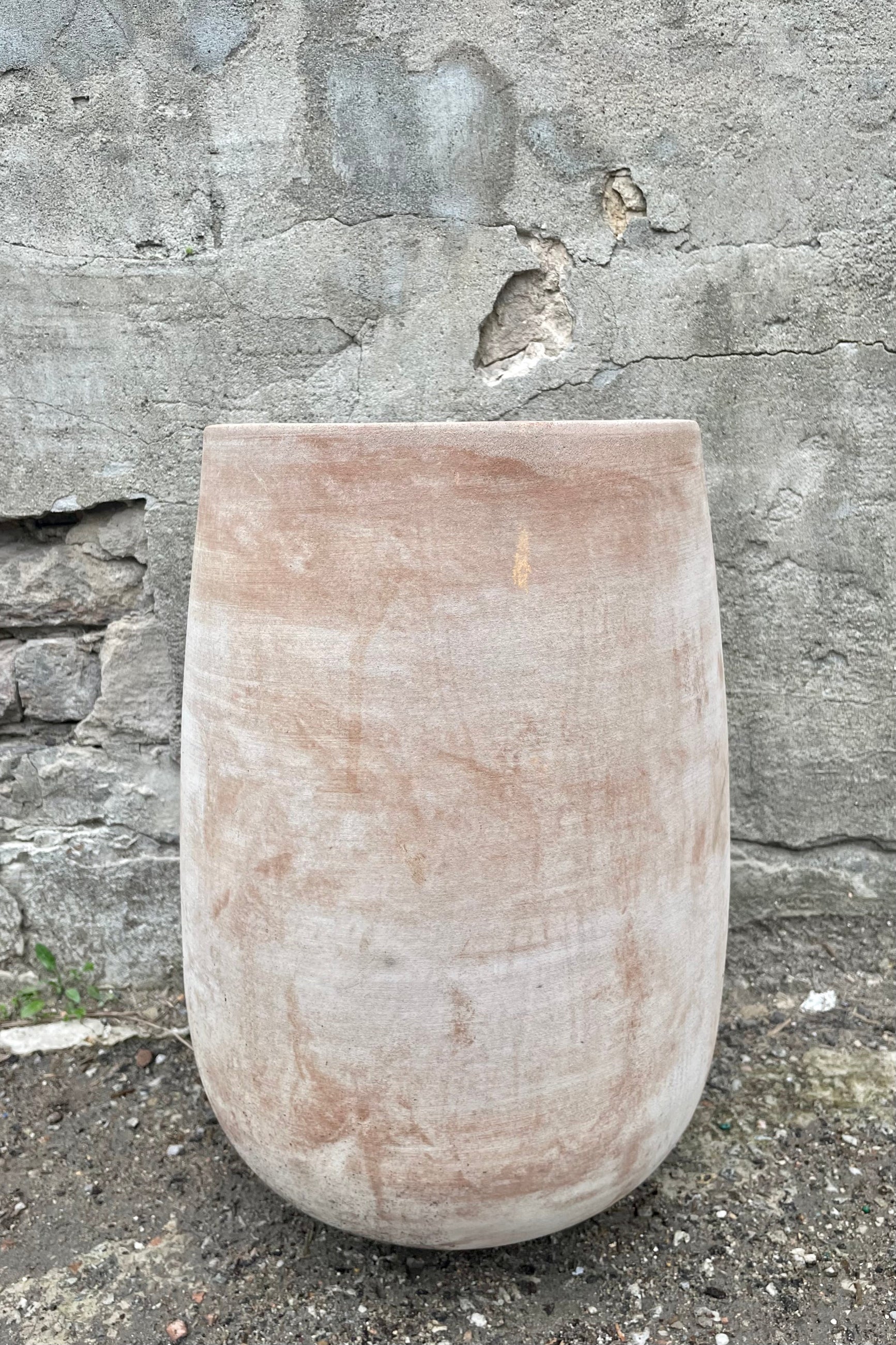 Yumiko Unglazed Crucible Small against a grey wall  ©Sprout Home 